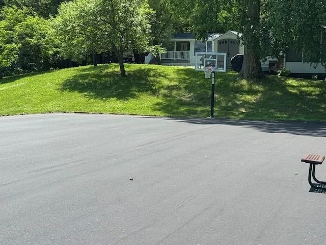 Hoops anyone complete with fresh asphalt.