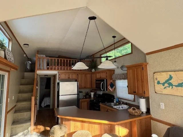 Kitchen with breakfast bar and all appliances.
