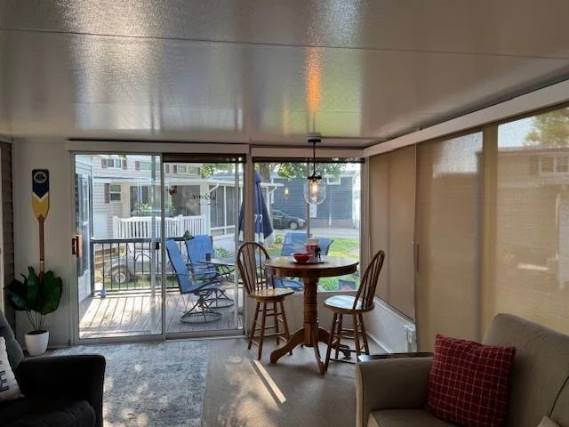 Huge 20' x 12' lake side Screen and window Family room complete with shades  for sleep over guests.