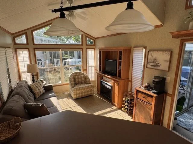 Lots of natural light with all the windows.Notice the Built ins with Fireplace