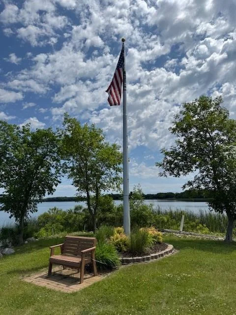 Landscaped picnic area with flag pole