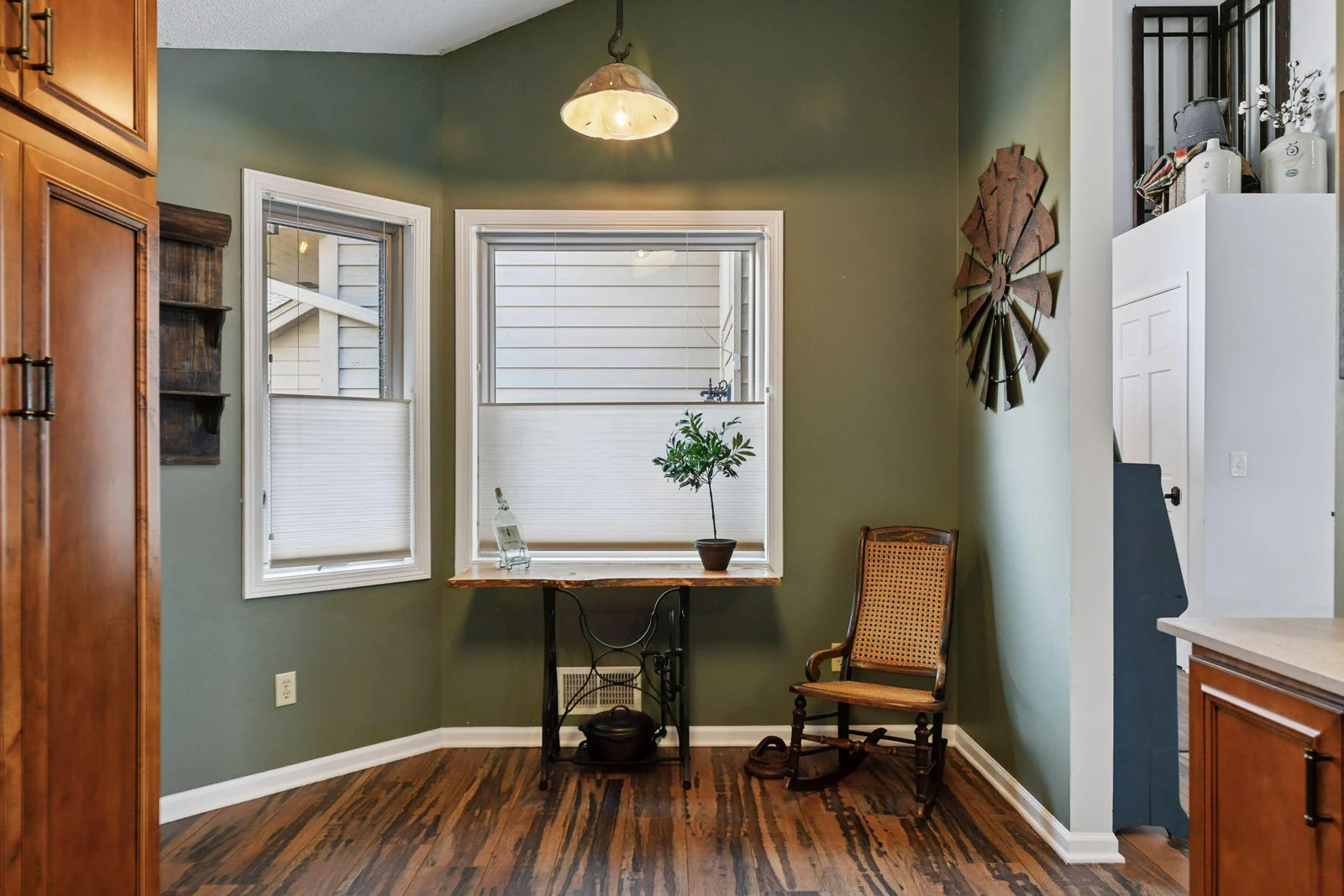 A charming eat-in kitchen nook, perfect for a cozy table or as a stylish spot for decor or a fun entertainment piece.