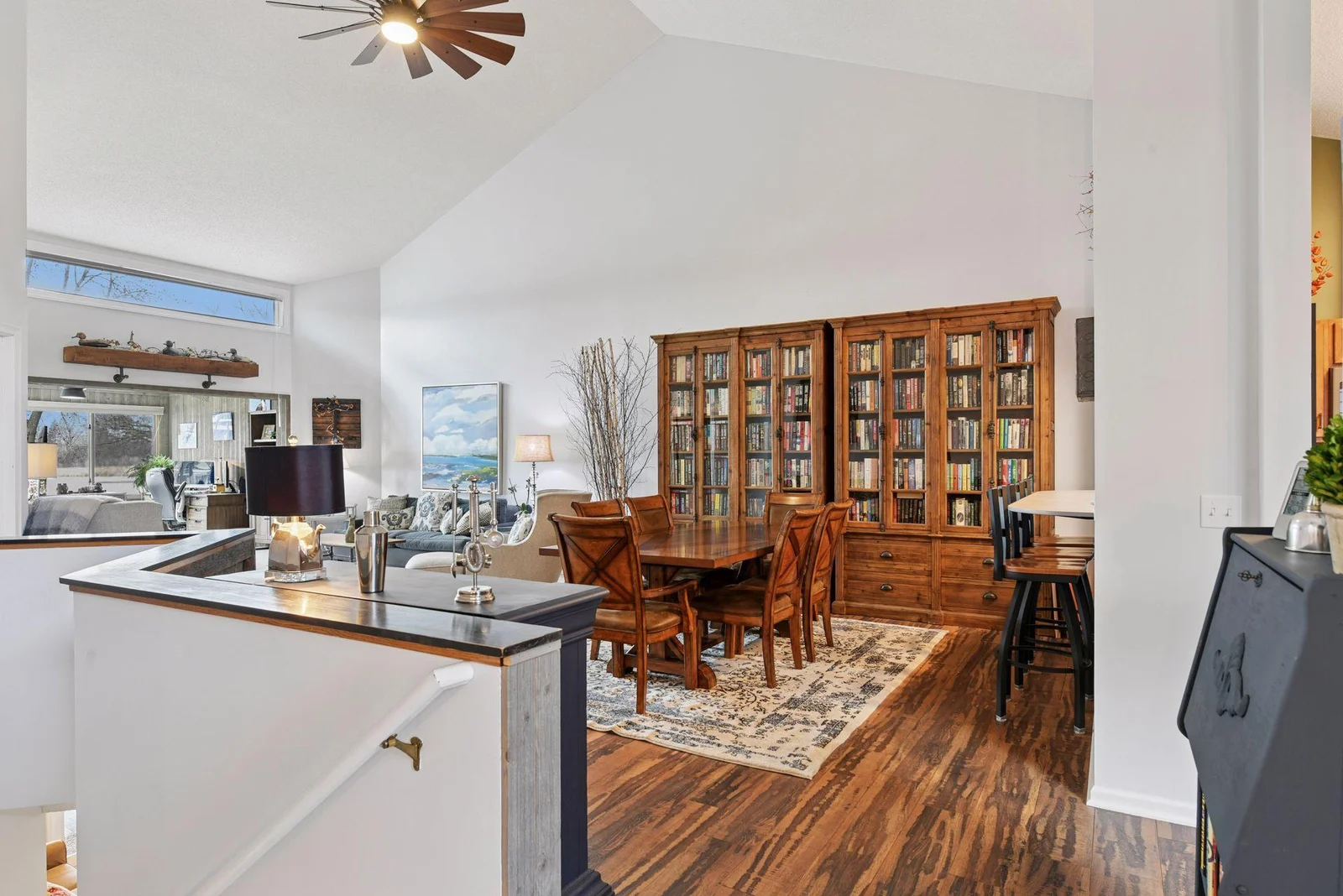 Stunning custom wood flooring throughout the main level adds a crisp, beachy charm to this lakefront townhome retreat
