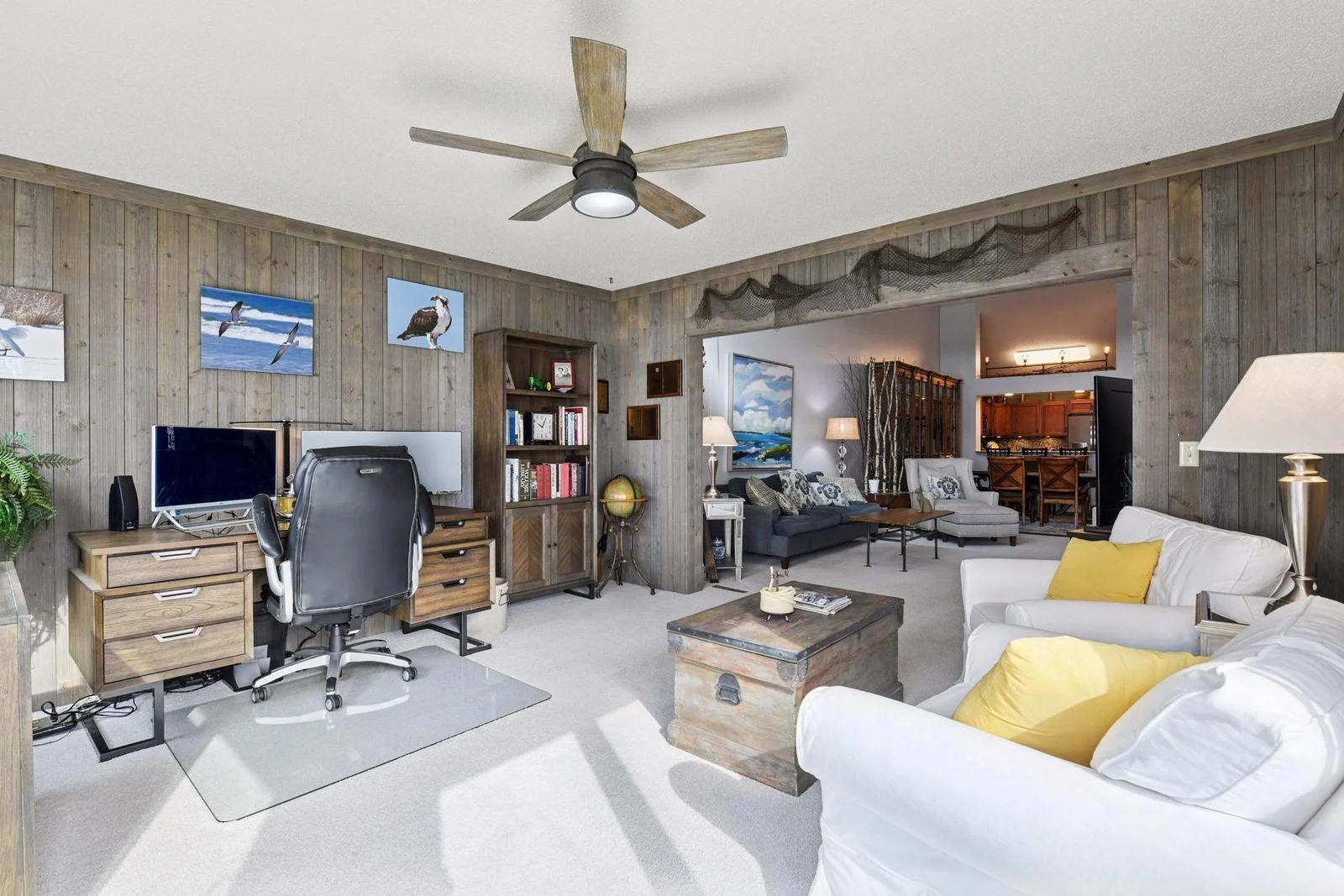 Step inside to a bright, cheerful sunroom that flows seamlessly into the heart of the home—perfect for staying connected to every conversation and all the action.