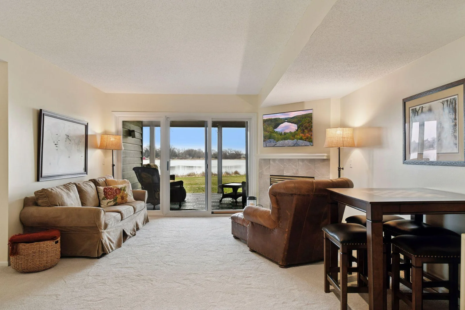 Step out onto the back patio—an ideal spot to sip a drink, share great conversation, or soak in the peaceful natural setting with Burandt Lake as your backdrop. Perfect for relaxing with guests, and a great candidate for phantom screens if you’d like