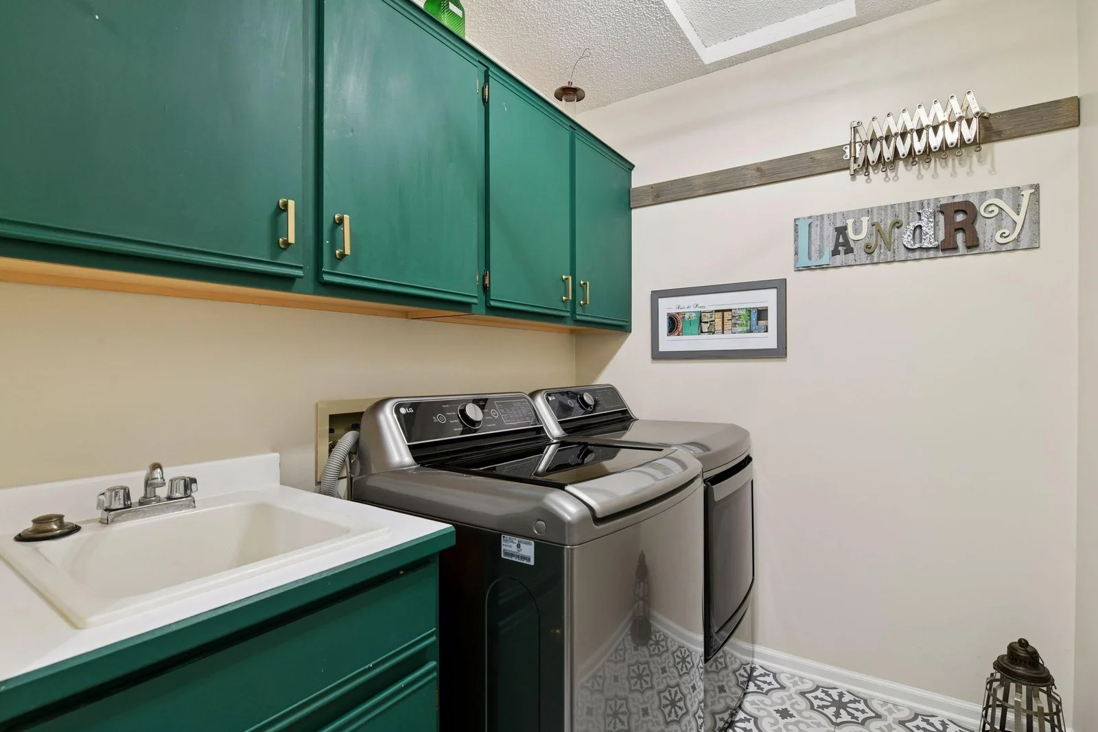 The main level features a brand-new washer and dryer, plus a convenient utility sink, all with updated flooring for added appeal.