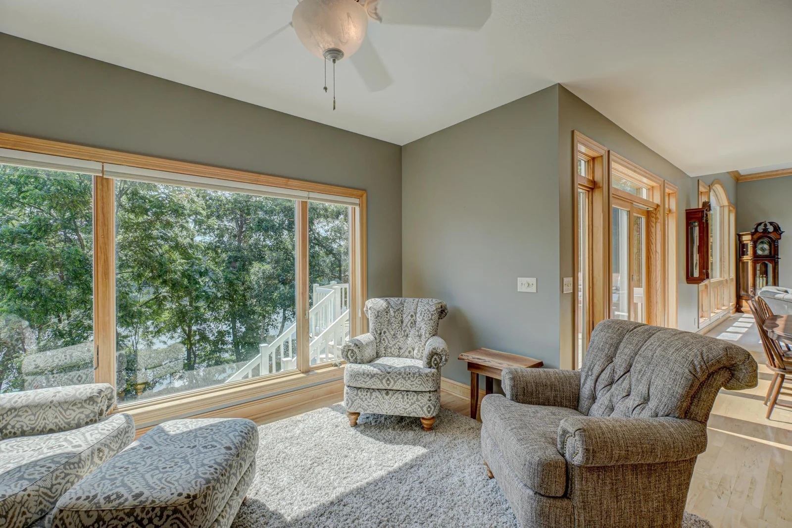 Off the kitchen, a beautiful sunroom provides a serene space to unwind. It’s the perfect spot to enjoy your morning coffee while taking in panoramic lake views.