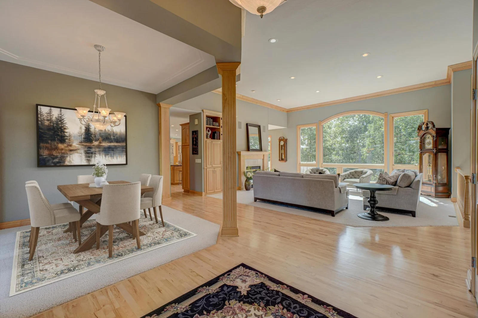 This cozy yet spacious walk-out rambler offers the perfect blend of peaceful seclusion and modern comfort. (dining room virtually staged).