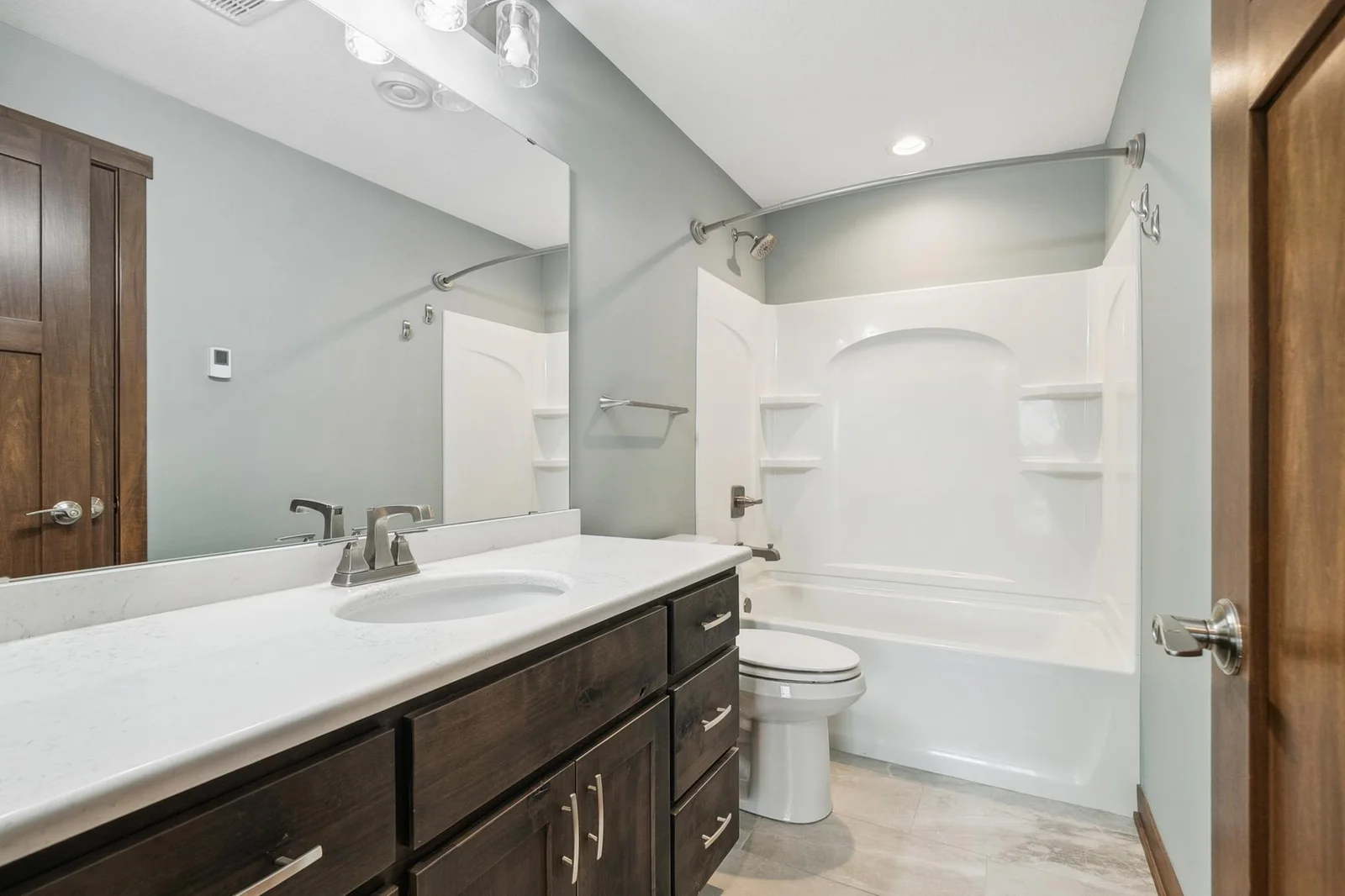 Full bathroom with heated floors, comfort and style on the lower level.