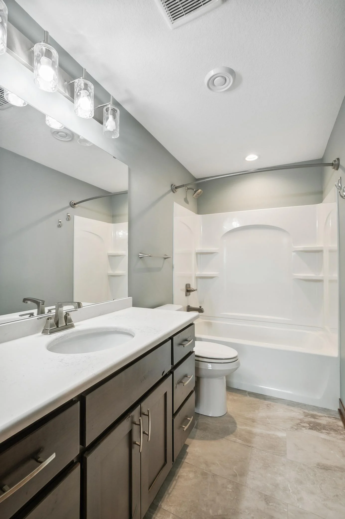 Modern design meets cozy warmth in this beautifully finished lower-level bath.
