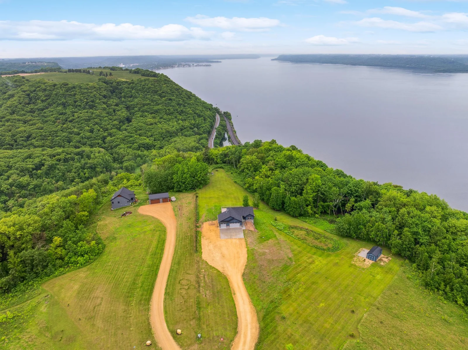 Welcome to a rare blufftop retreat perched above the Mississippi River Valley—one of only seven bluff points in Lake City. This 3.3-acre property offers incredible privacy, nature, and modern comfort, all with sweeping views of Lake Pepin and beyond.
