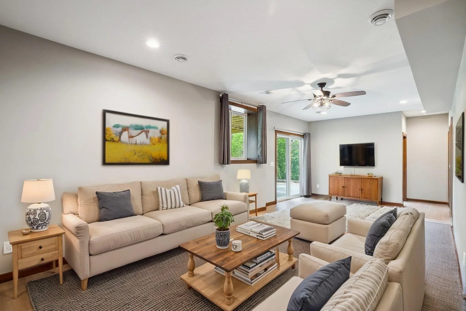virtually staged. A versatile area designed for movie nights, game days, or cozy gatherings.