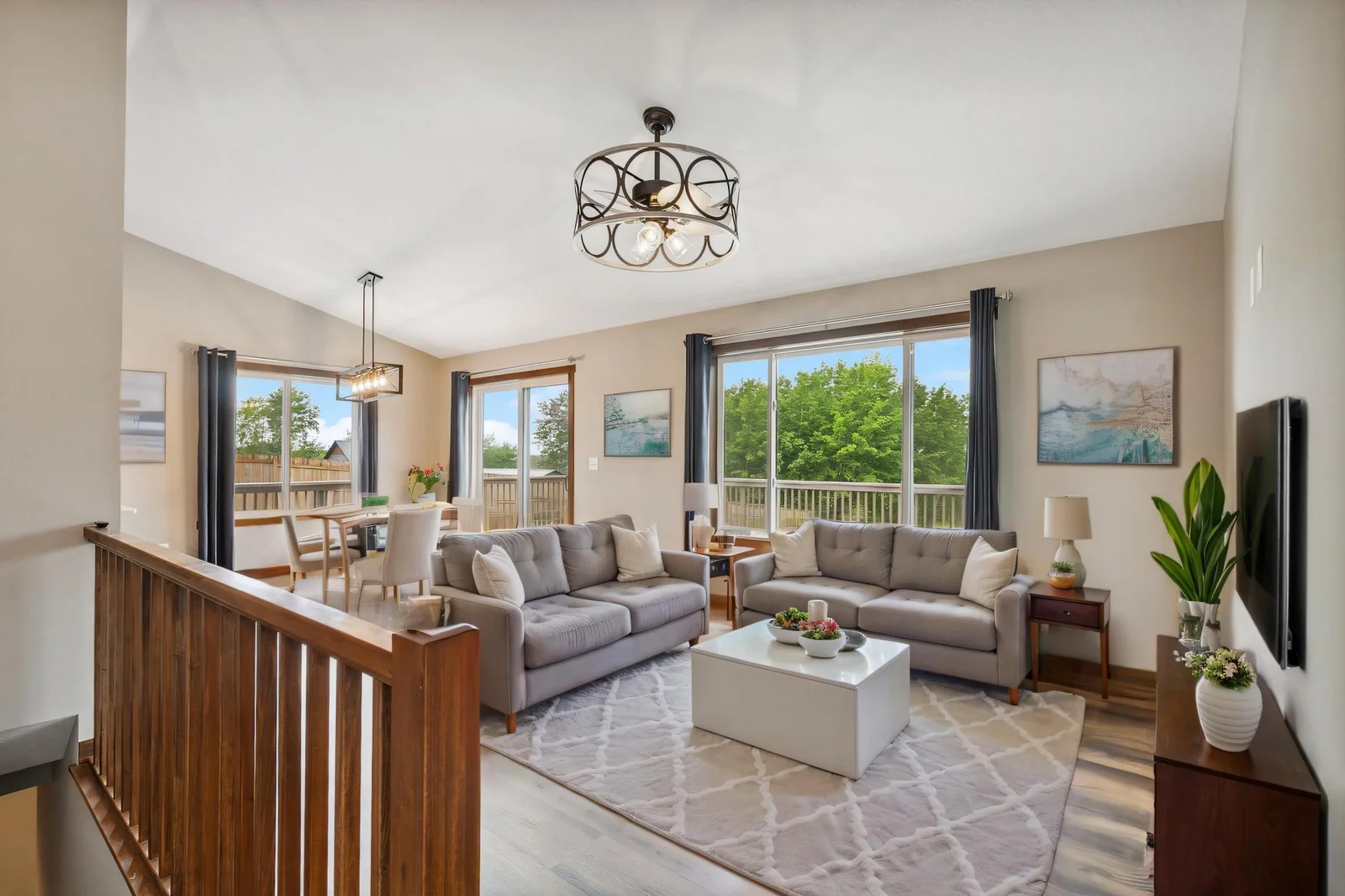 Vaulted ceilings and panoramic windows make every moment feel expansive and bright. Virtually Staged