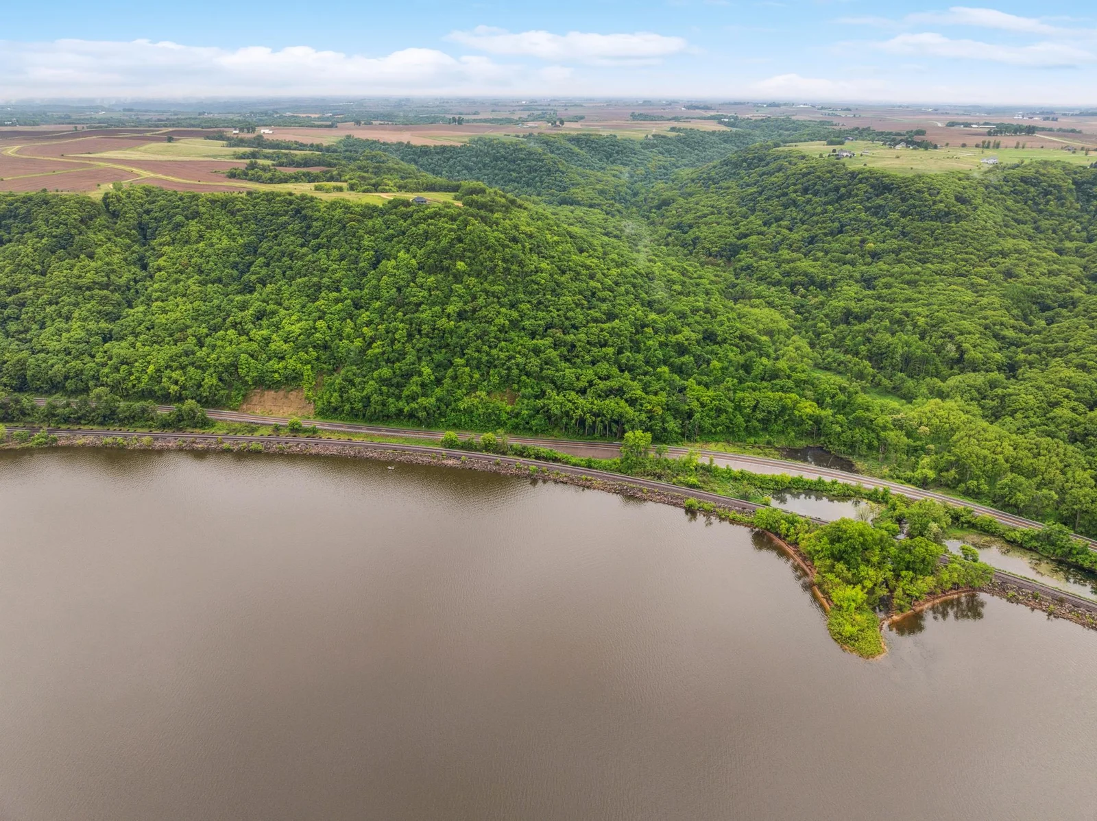 From above, the full beauty of this 3.3-acre blufftop retreat comes to life—privacy, nature, and unmatched elevation.