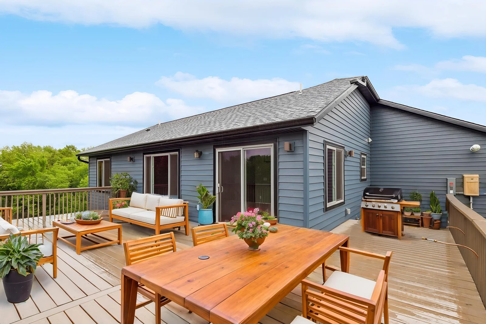 virtually staged. Outdoor living shines with an expansive deck, with two gas hook ups!