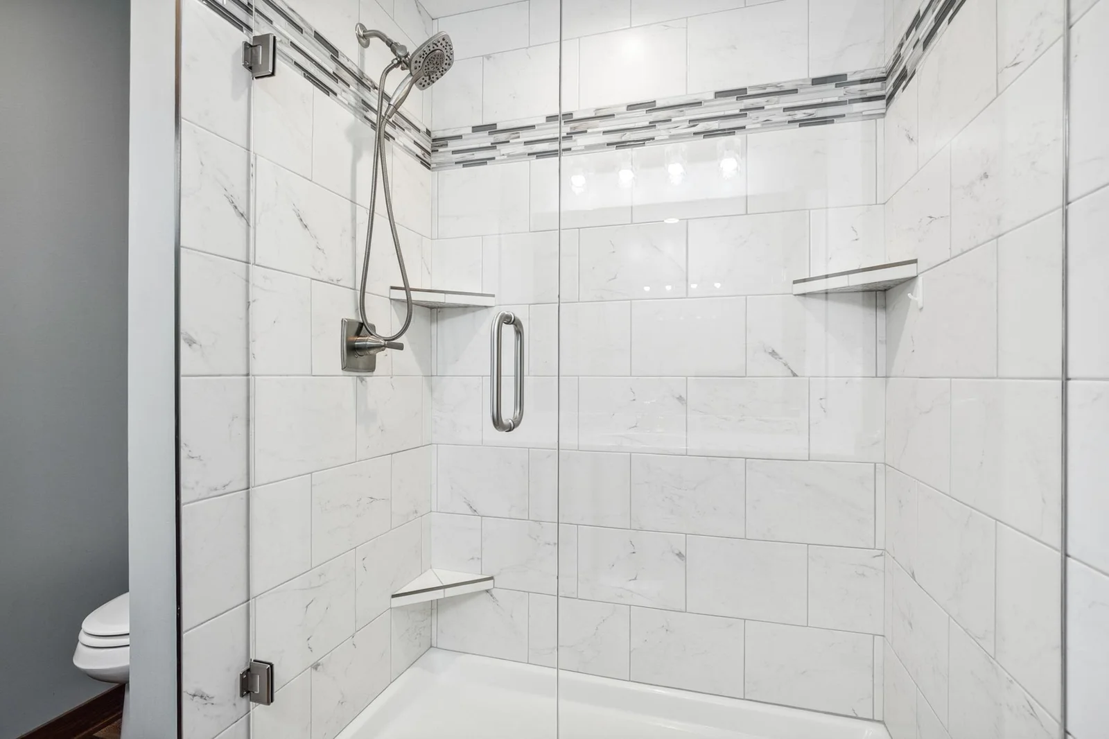Beautifully tiled with modern finishes, this bathroom offers a spa like retreat.
