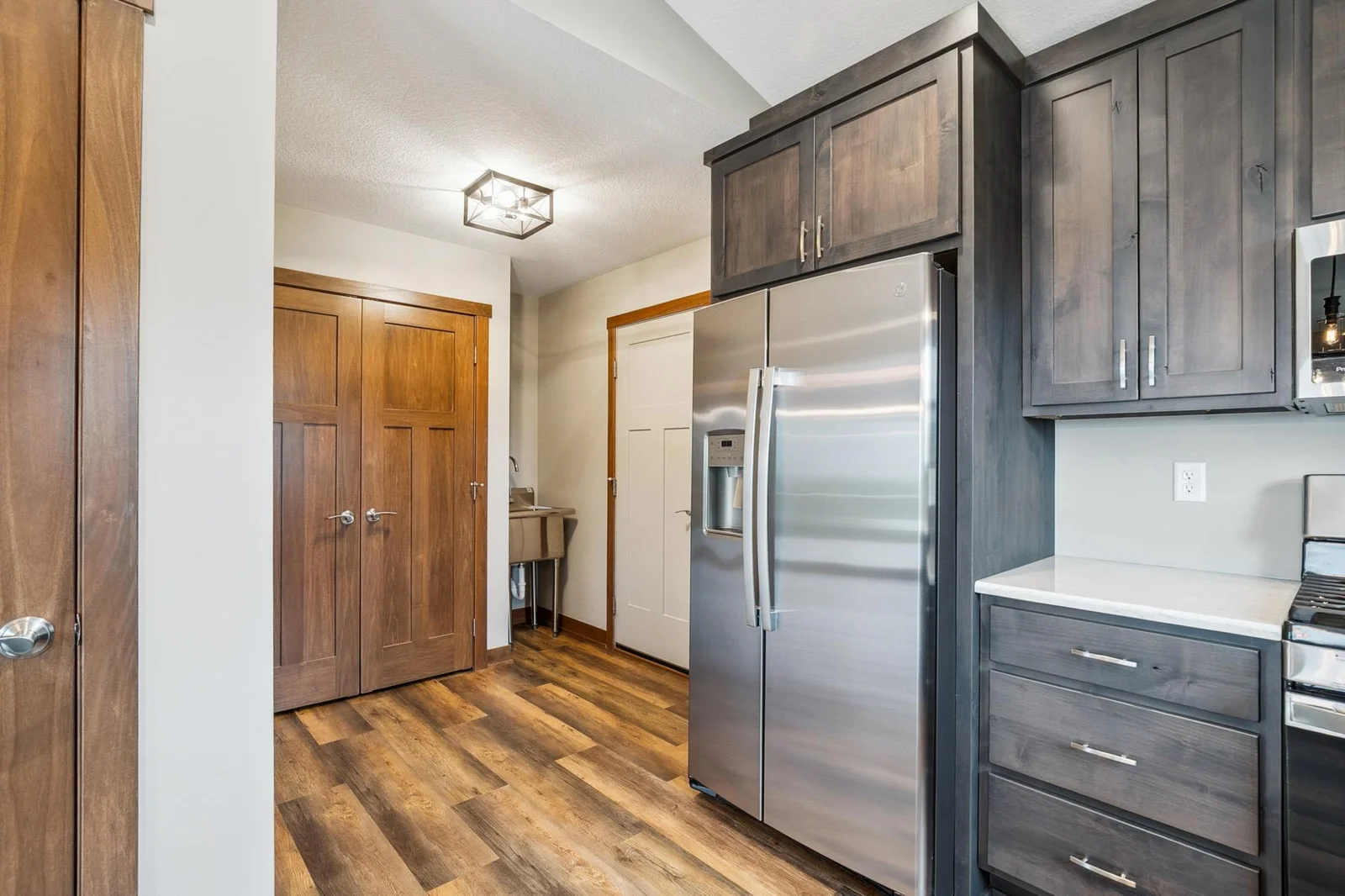 Warm wood tones and custom finishes create timeless style.
