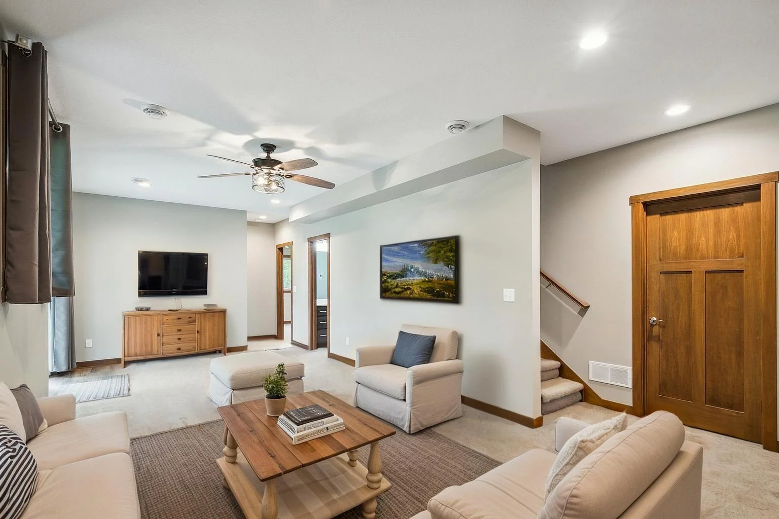 virtually staged. Spacious family room with 8.5’ ceilings—perfect for relaxing or entertaining.