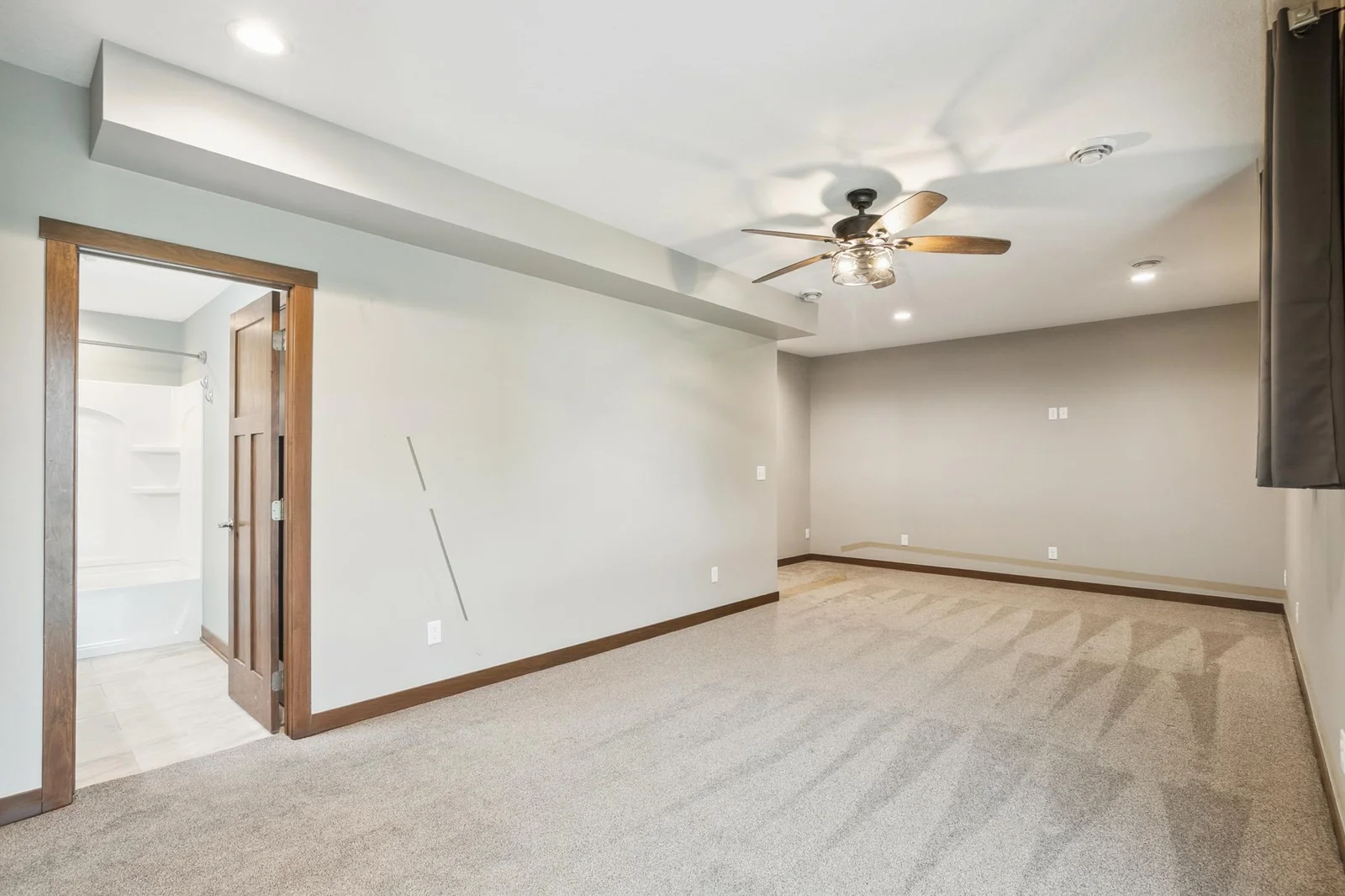 Generous room with plenty of natural light and direct access to the patio.