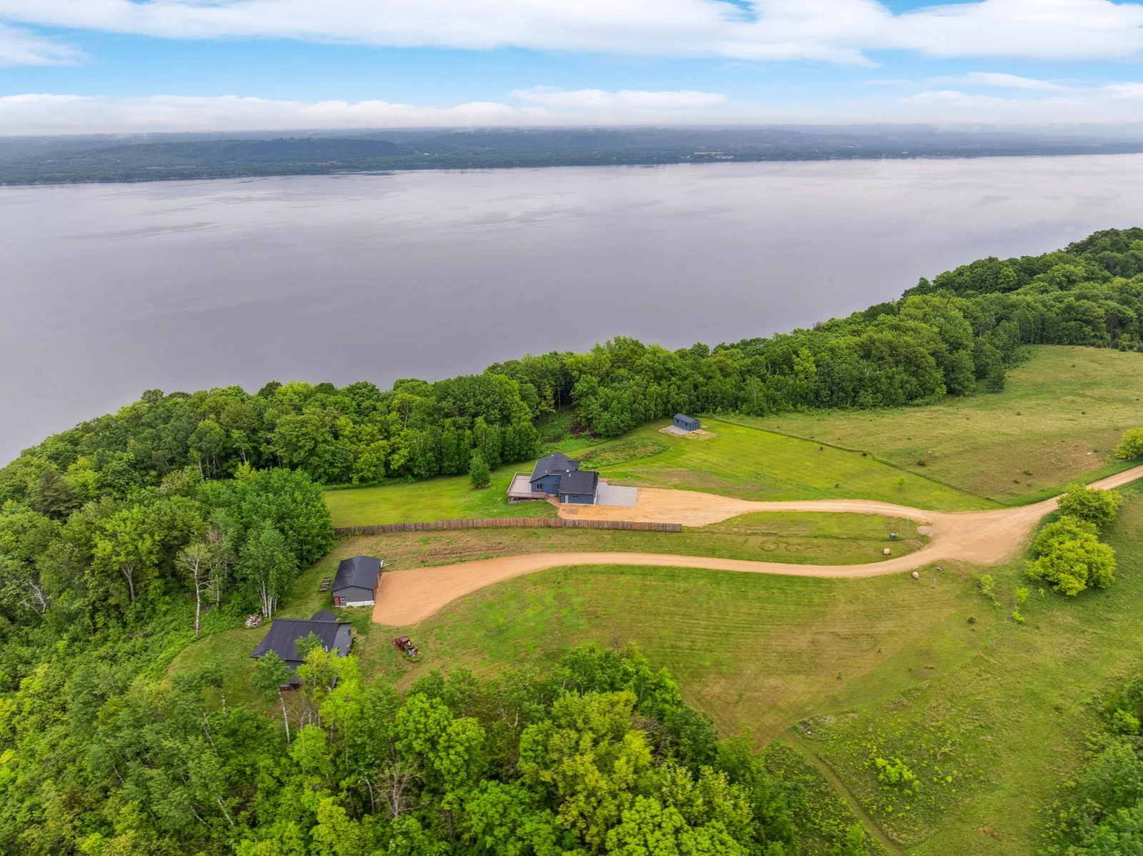 From above, the full beauty of this 3.3-acre blufftop retreat comes to life—privacy, nature, and unmatched elevation.