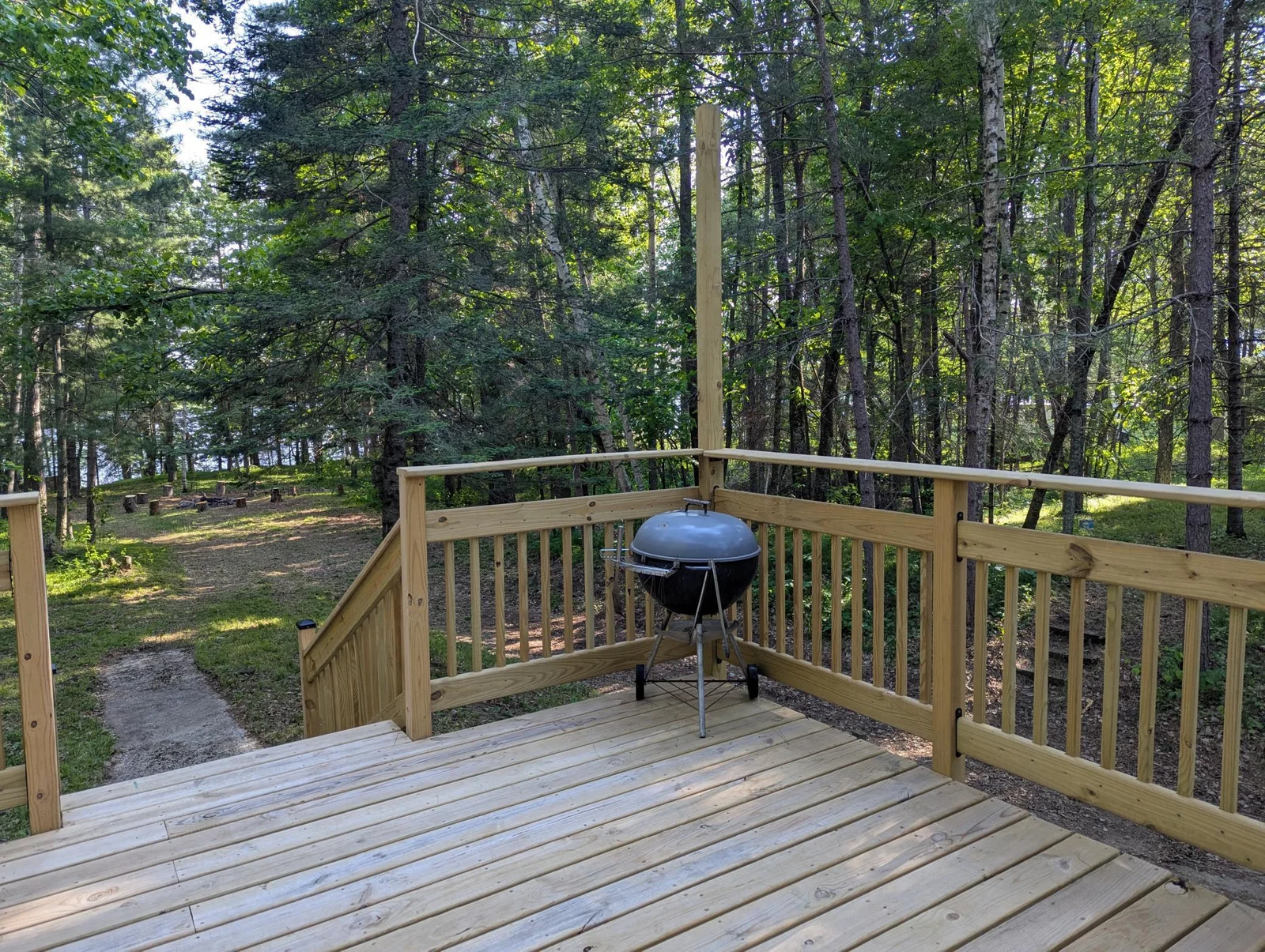 View to the firepit from Lake side deck