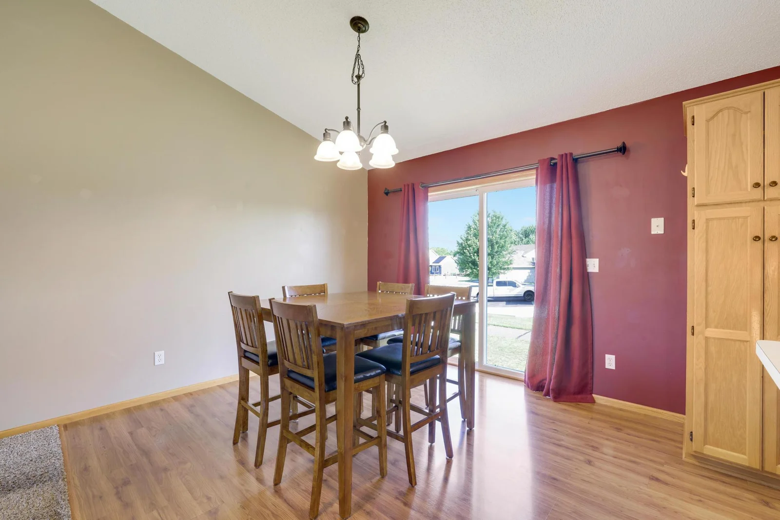 Spacious Dining Room with sliding glass door with backyard views