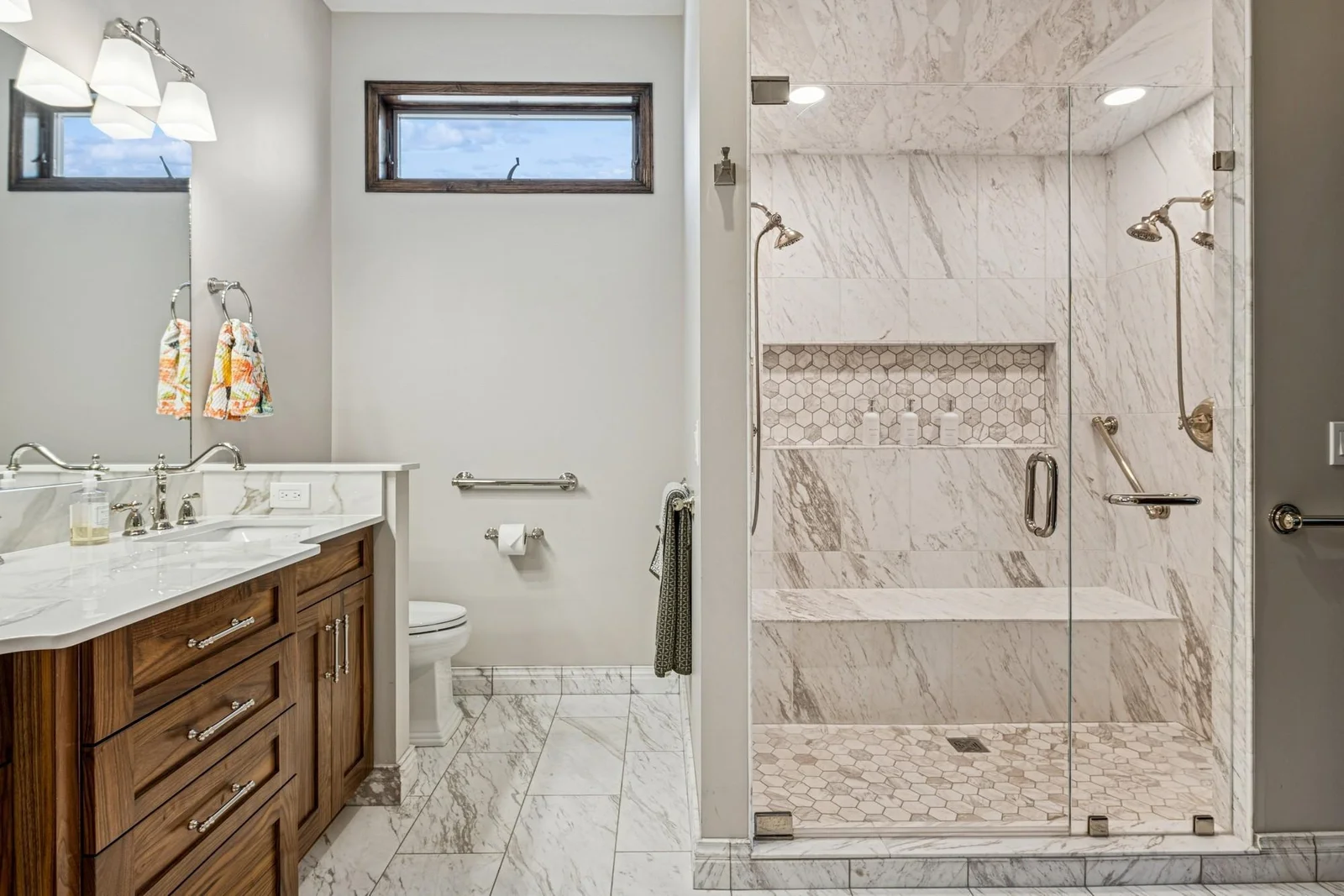 Dual shower heads and custom marble tiling