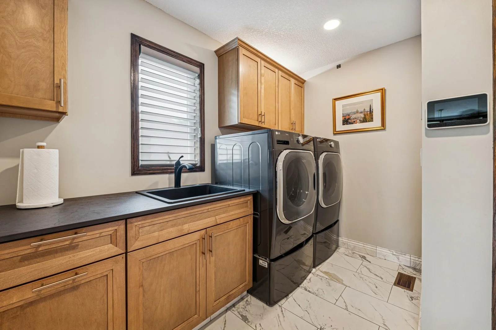 Separate laundry room with entry to the garage