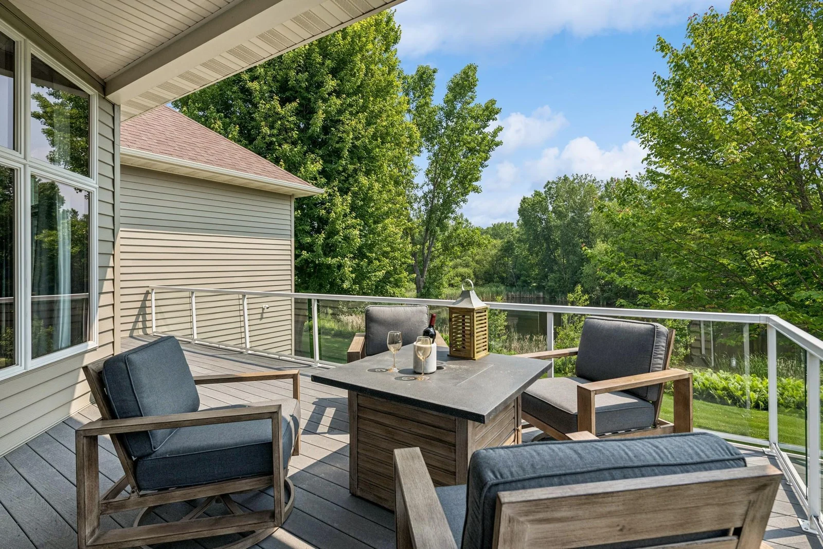 Upstairs deck, view of the pond and Sunrise Lake