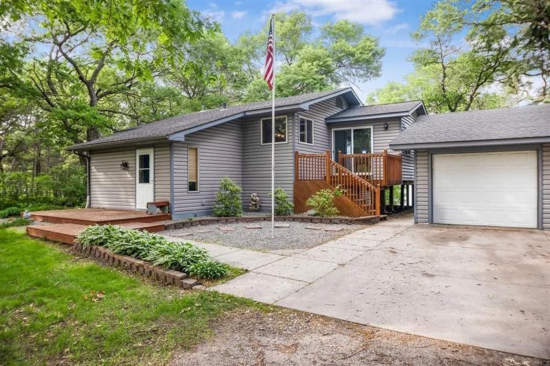 Front of House, 3 season porch, and Garage