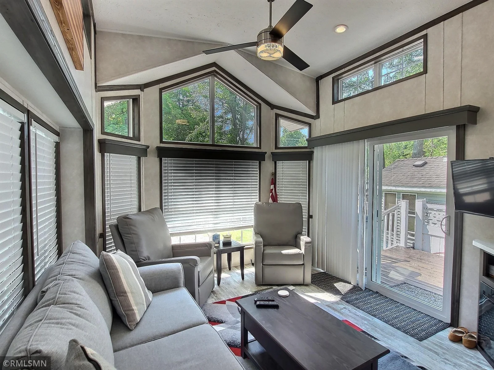 The living room area with direct access to large side deck.