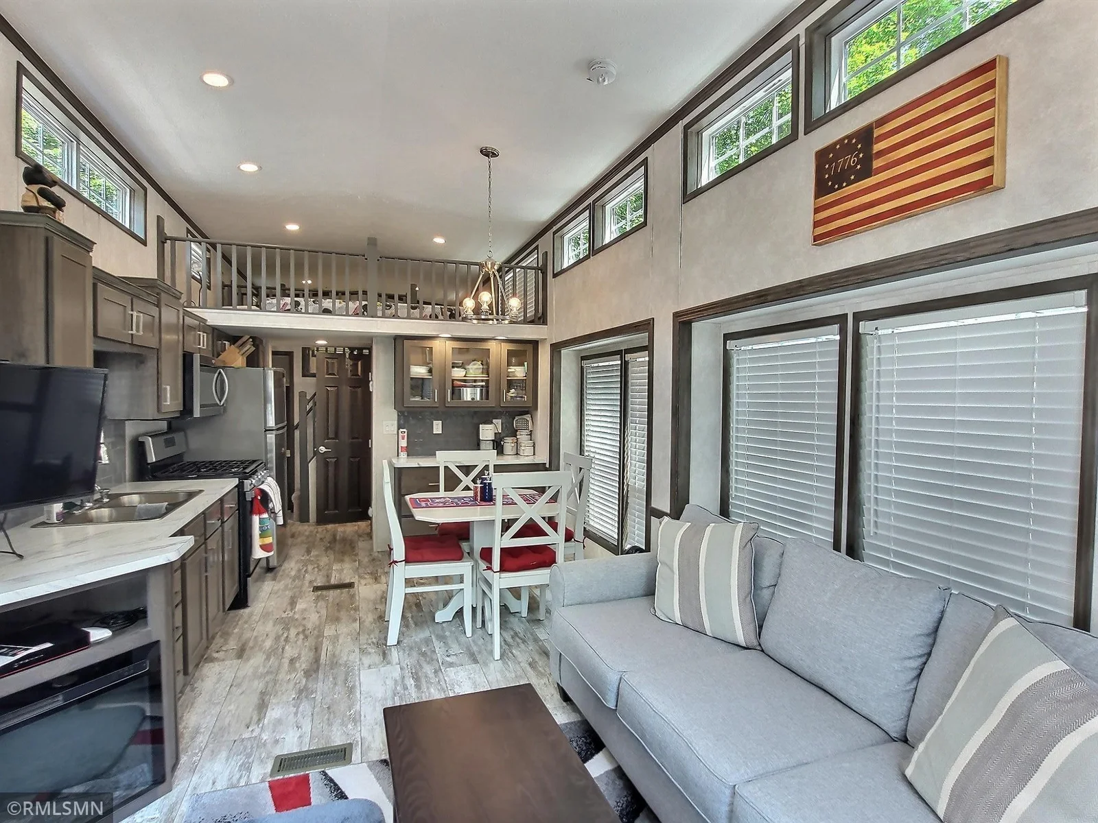 This 2023 Park Model offers low-maintenance, modern living with 1 bedroom, 1 full bath, and two spacious loft areas currently used as sleeping quarters.