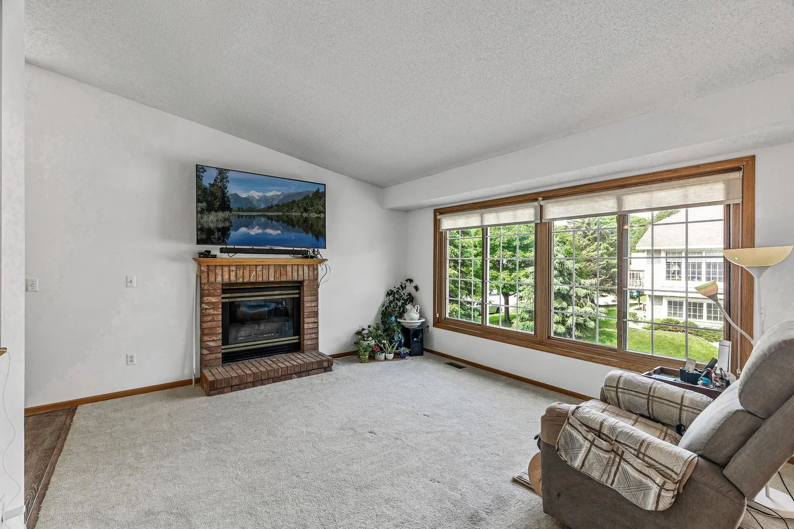 Upper level living room with gas fireplace