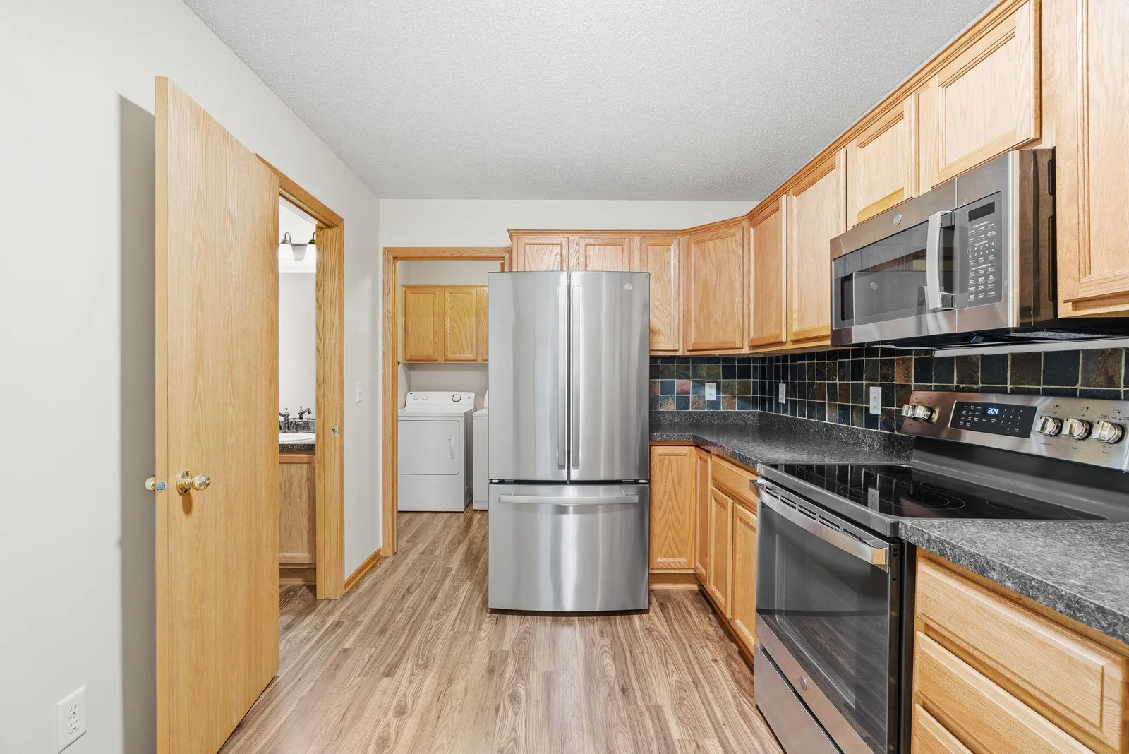 Kitchen with laundry and half bath attached