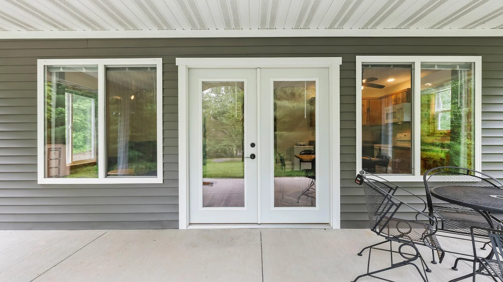 All new doors and windows! All the work was completed in 2022; roof, windows, siding, insulation, electric, covered patio, 3/4 bath and new kitchen - see the full list!