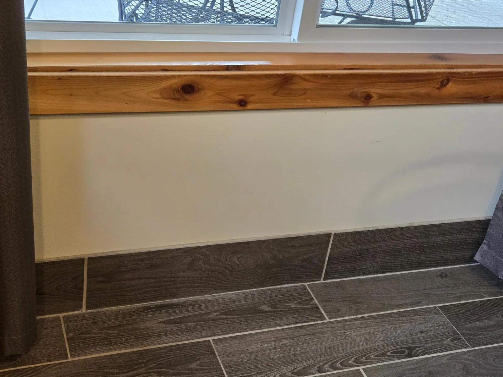 Just a close up of the cedar trim and the ceramic flooring - really gives this home a beautiful finish!