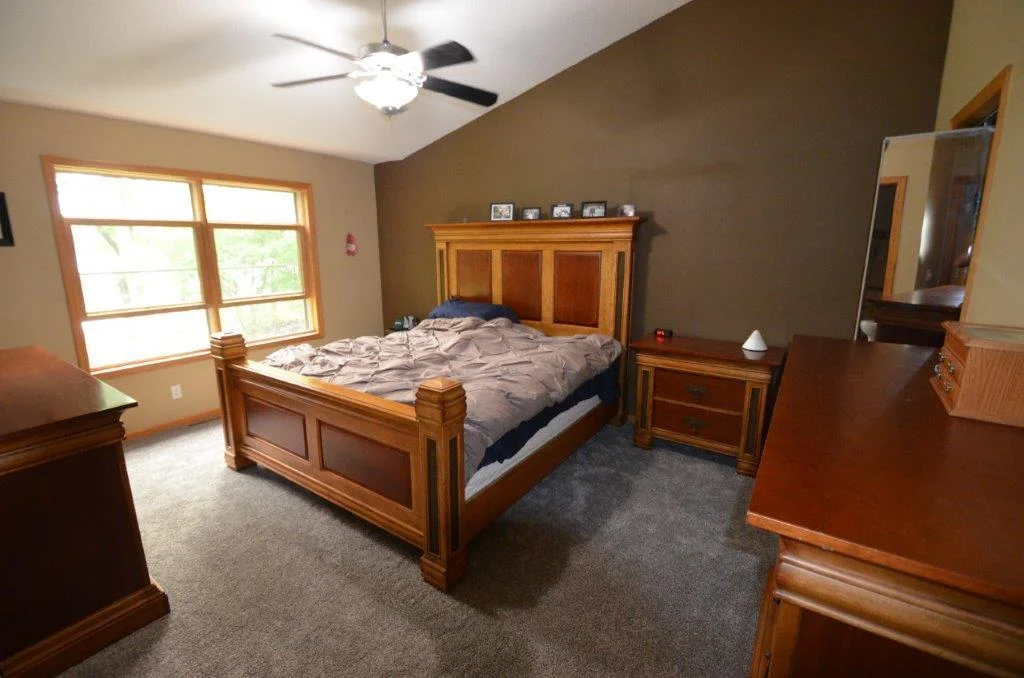 Primary bedroom with view of lake