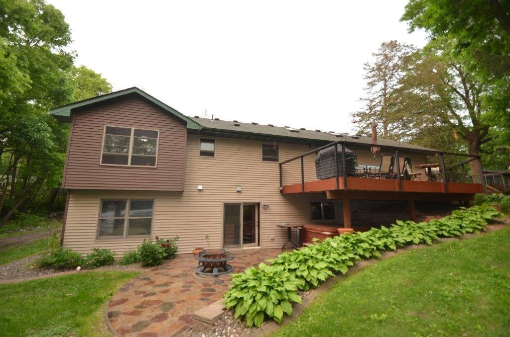 Large stamped concrete patio and rear deck are both the ideal setting for early morning coffee, gatherings or just a quiet evening.