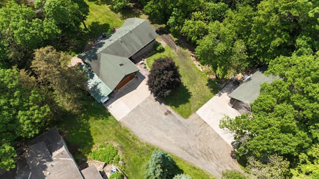 plenty of parking here with attached garage, carport, and pole barn