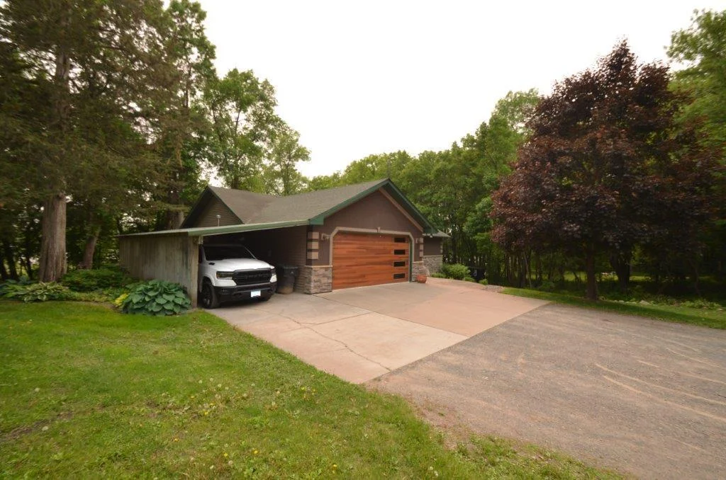 Heated Garage with added carport