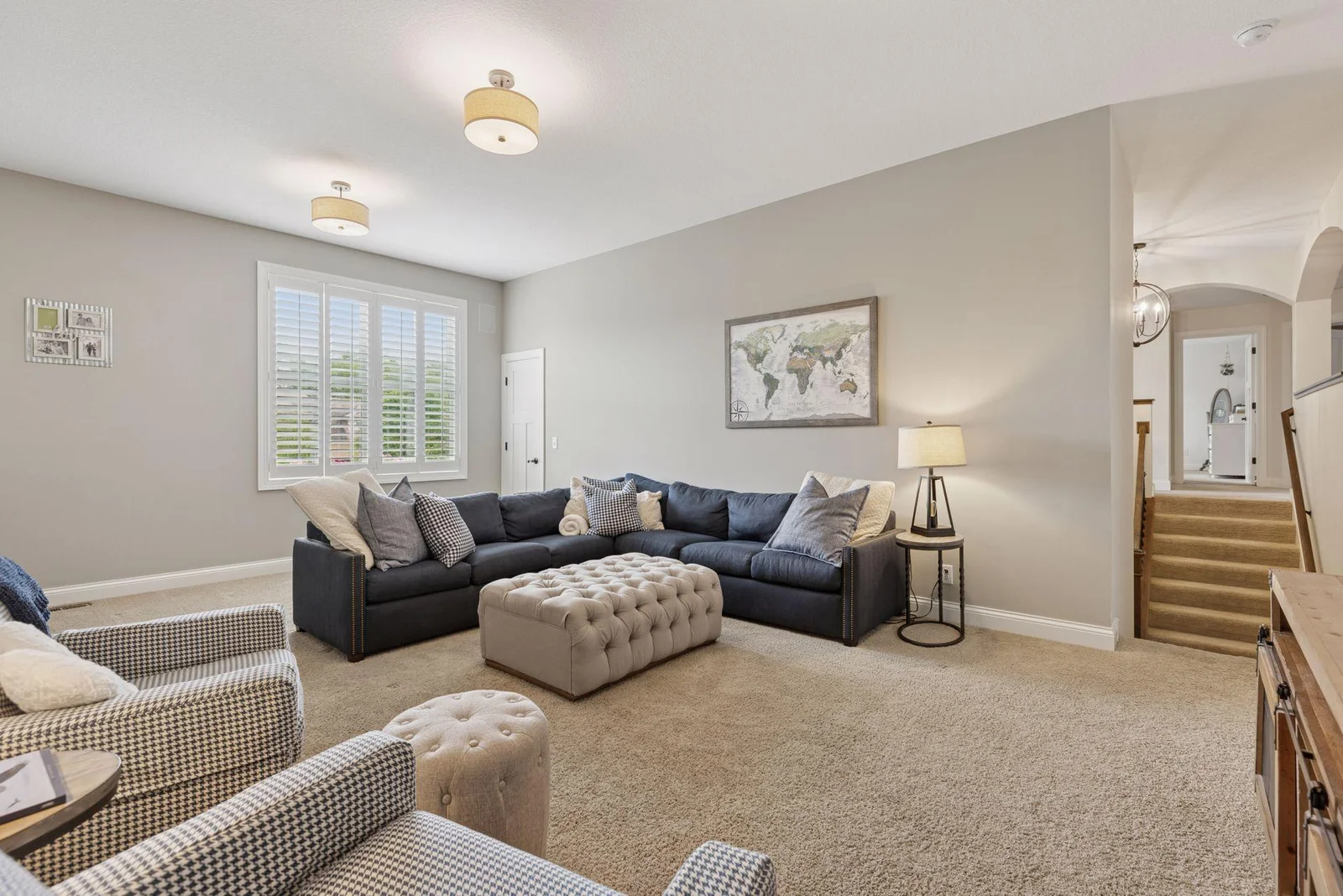 An alternate view of the upper-level family room reveals a convenient storage closet tucked in the corner.