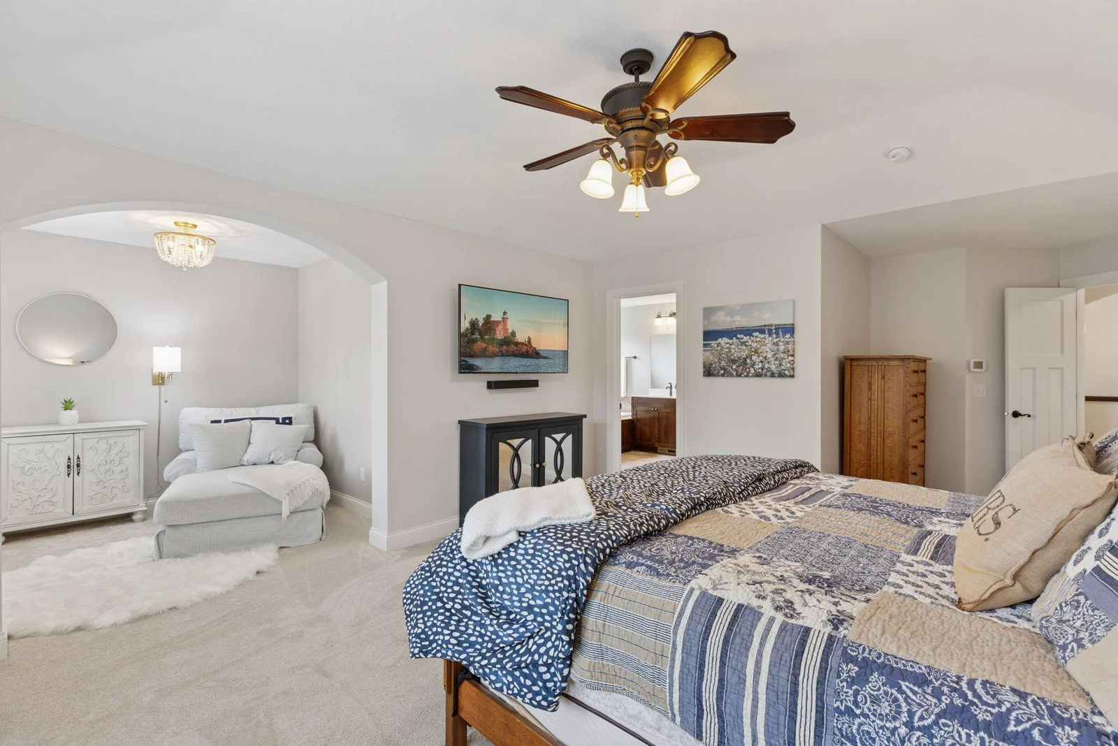 An alternate view highlights the inviting reading nook up close, showcasing its cozy charm and natural light. You’ll also see the seamless access to the luxurious primary bathroom, just steps away for added convenience.