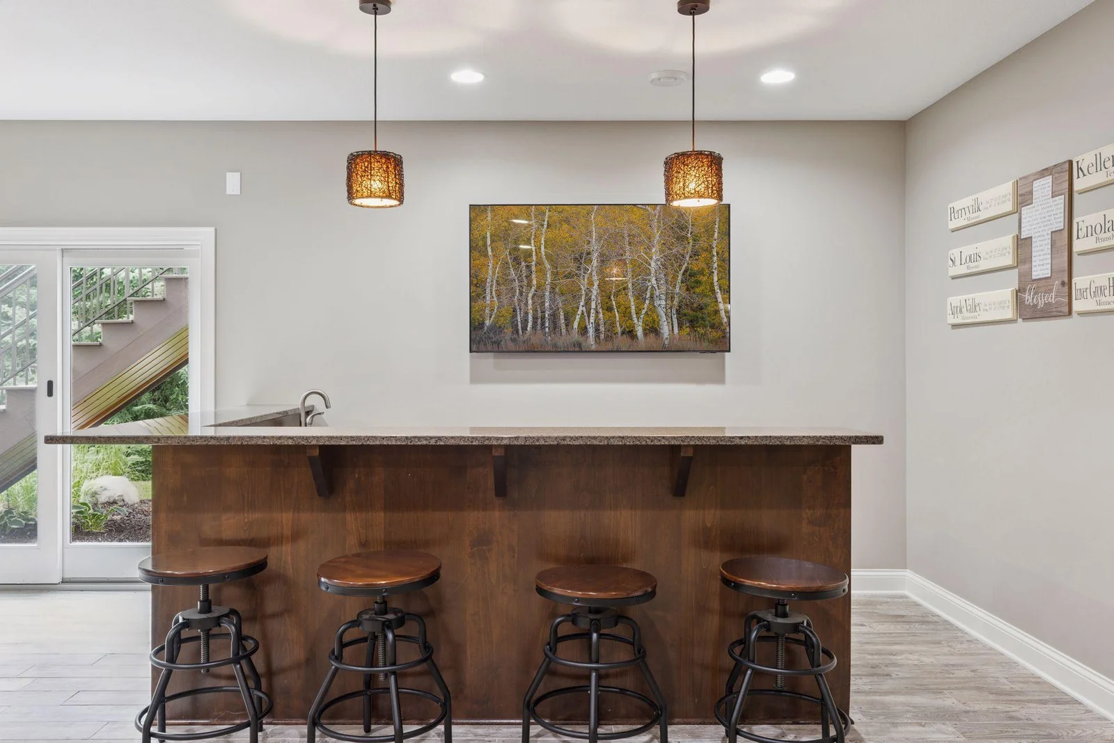 The stunning wet bar steals the show with sleek granite countertops, a mini fridge, and microwave—everything you need for easy hosting. With ample bar seating, it’s a natural gathering spot during parties or game day.