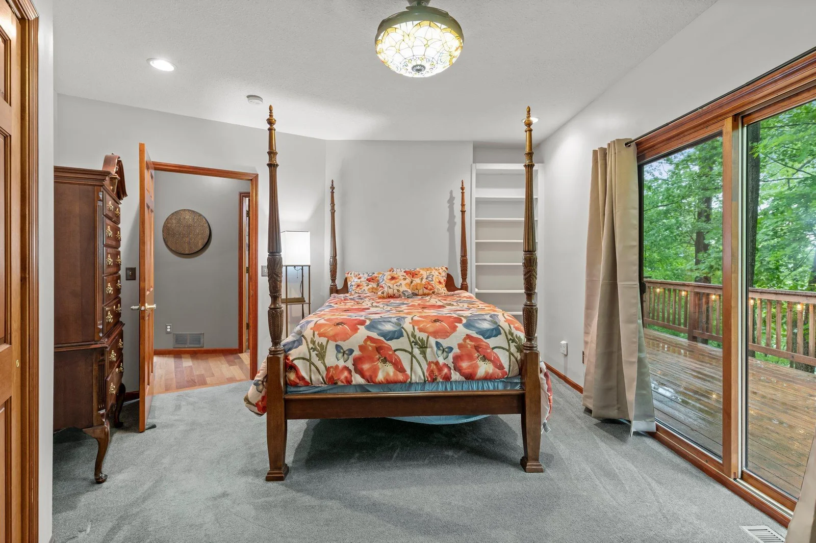 Main floor bedroom with walkout to deck