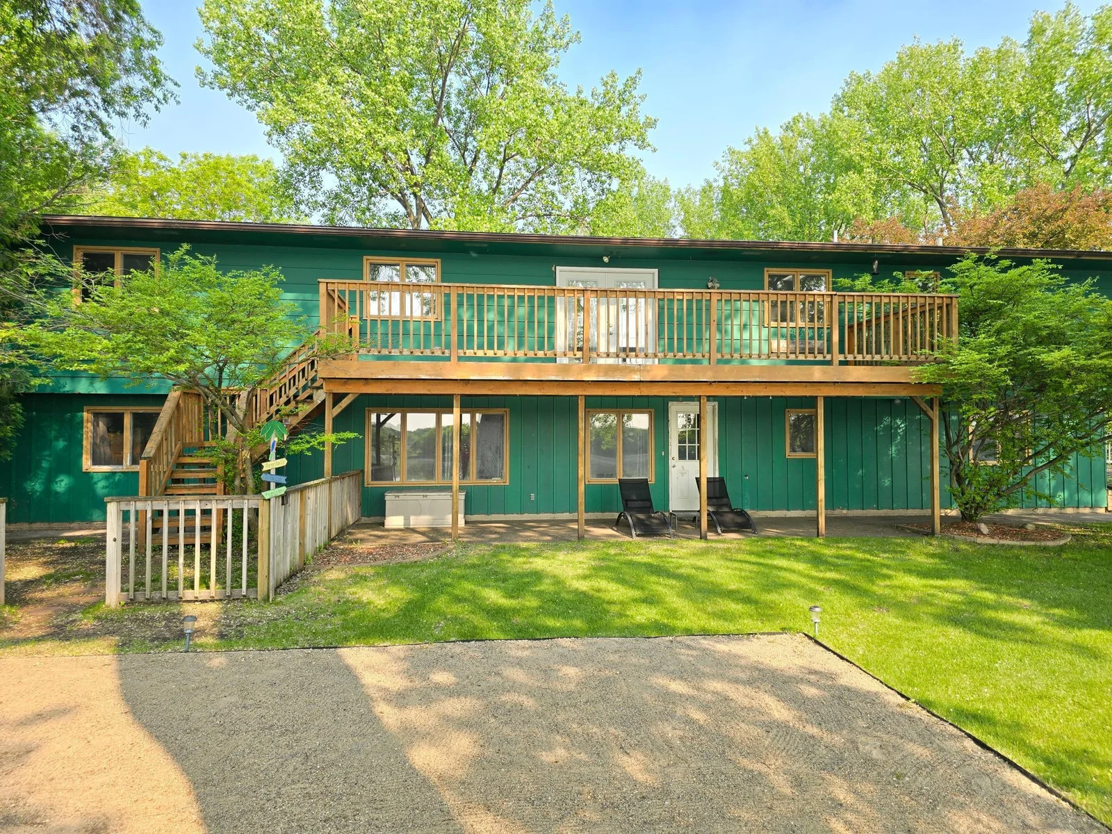 Large deck with fenced in dog area at the bottom.