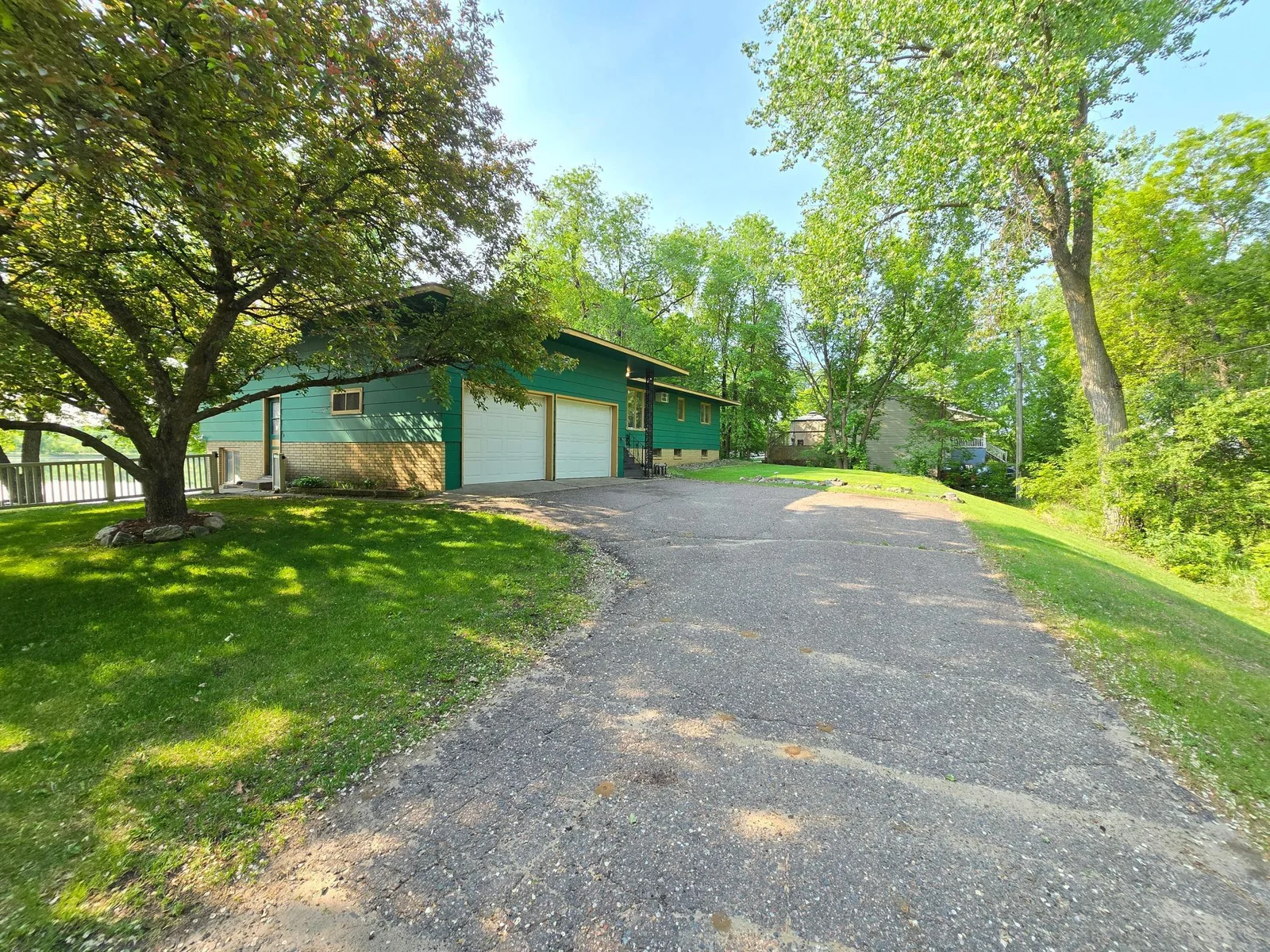 Asphalt driveway up to the main garage