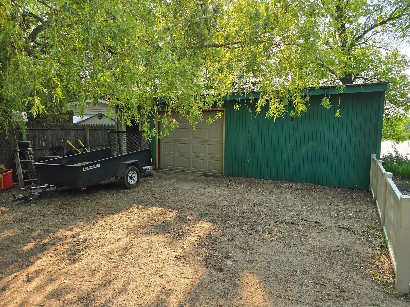 Detached garage is double size, but only 1 door. Also a lean to on the left side for more storage!