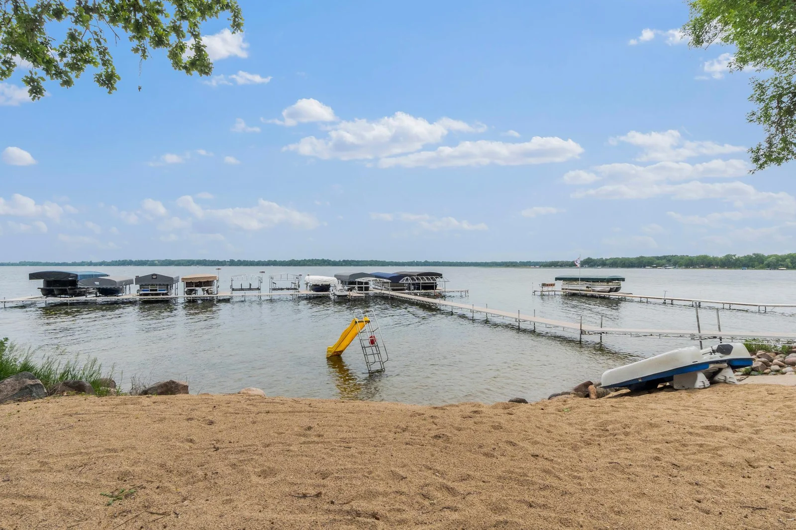 Relax on the sandy beach and take advantage of the convenient boat slip for easy access to the water.