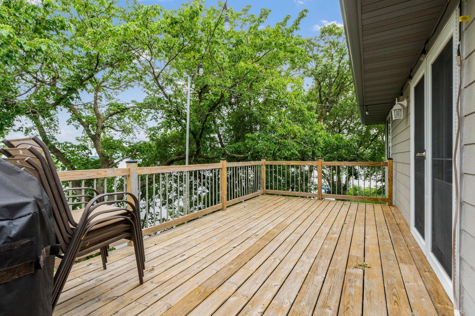 A generous deck offering beautiful views of the crystal-clear waters of Lake Miltona.