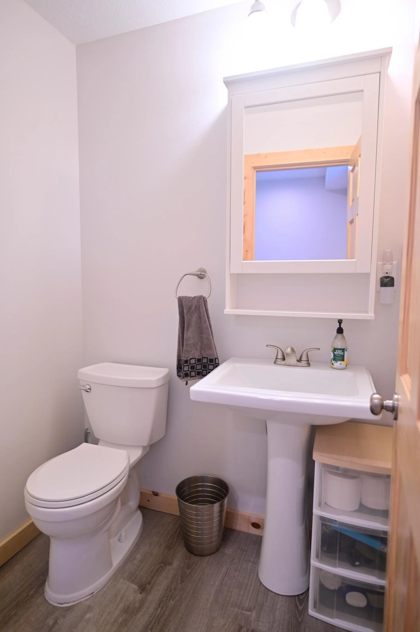 The lower-level bathroom is thoughtfully designed to comfortably accommodate guests.
